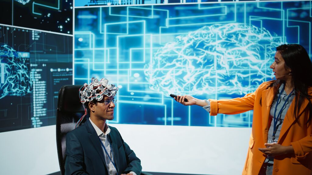 Frau hält eine Fernbedienung auf den Kopf eines Patienten der neuronale vernetzt ist